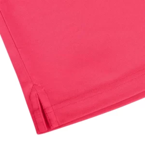 Polo Mukua BOGAN en color Fluor Coral, detalle del bajo