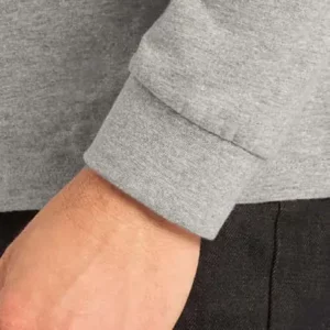 Detalle del puño y la manga de la camiseta Mukua PALM LONG SLEEVE TL190UC gris jaspeado.