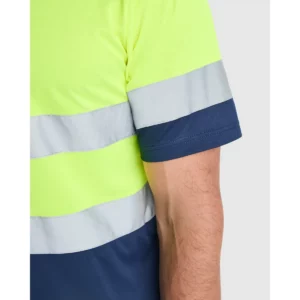 Polo Roly POLARIS en azul marino y amarillo flúor, detalle de la banda reflectante de la manga
