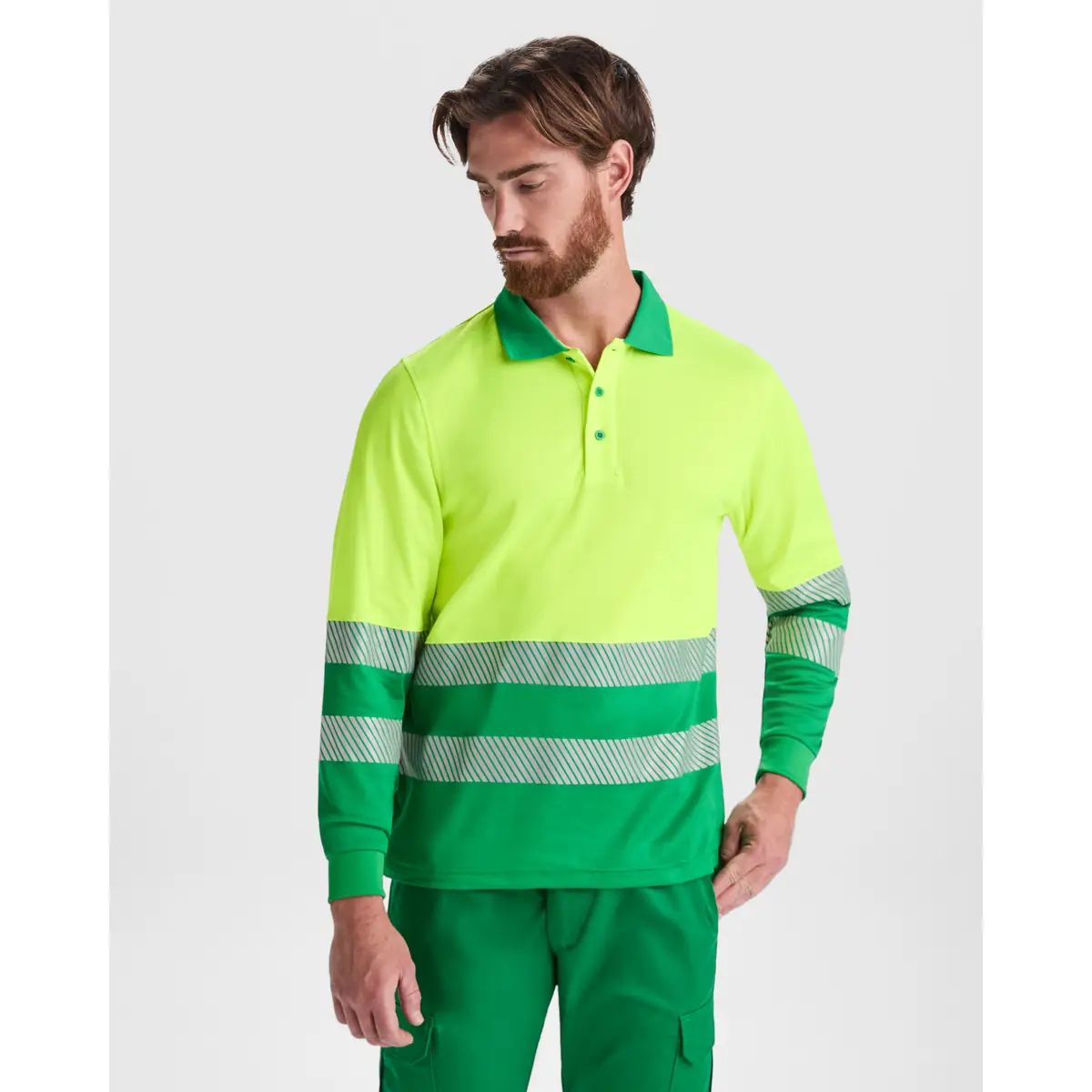 Polo alta visibilidad manga larga Roly ATRIO LS 2 Polo Roly ATRIO LS en verde jardín y amarillo flúor de manga larga, vista frontal con modelo