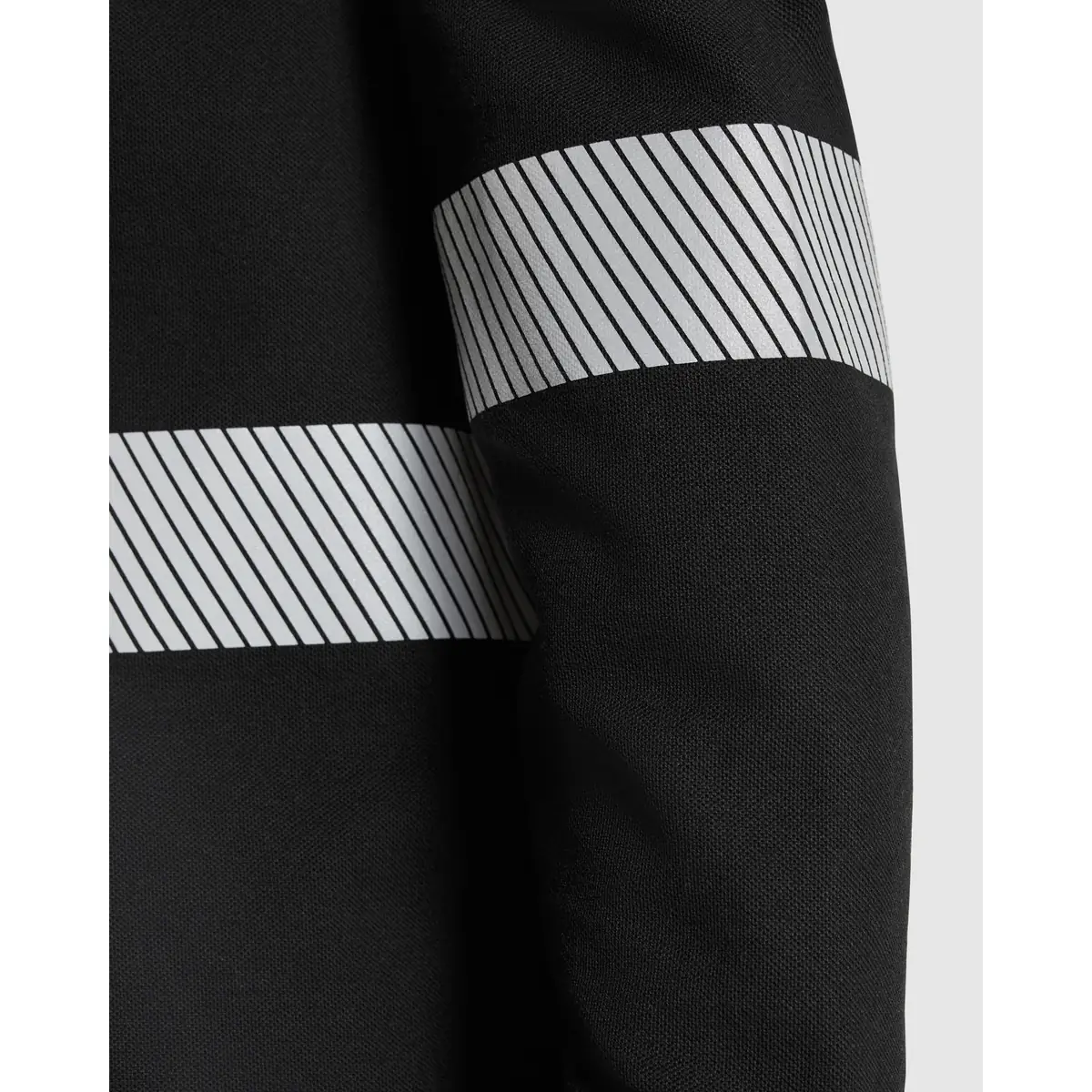 Polo visibilidad aumentada manga larga Roly FORAN L/S 16 Polo Roly FORAN L/S en negro, detalle de las bandas reflectantes