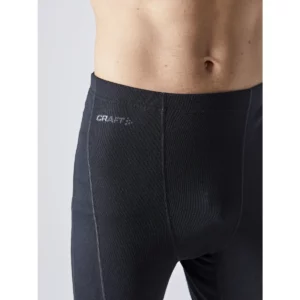 Conjunto térmico hombre CRAFT CORE WARM BASELAYER 1909709, Negro, con modelo, detalle frontal de la cintura del pantalón