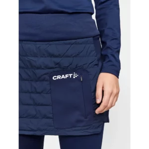 Falda mujer CRAFT CORE NORDIC SKI CLUB SKIRT 1912697, Blaze, con modelo, detalle del bolsillo delantero