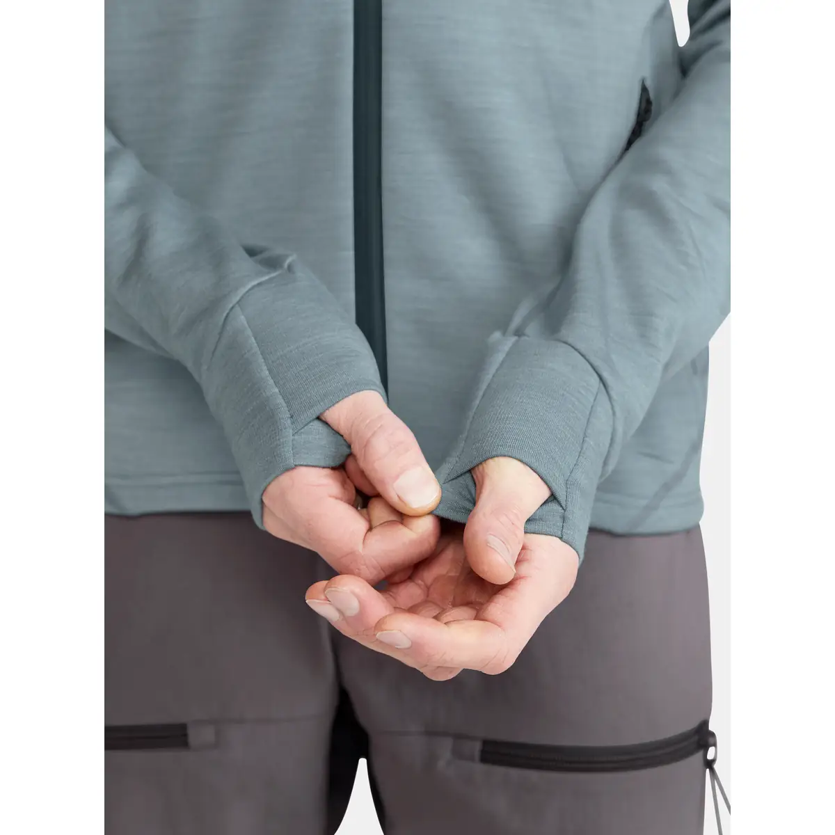 Chaqueta hombre CRAFT PRO EXPLORE WOOL MIDLAYER 1913800 12 Chaqueta hombre CRAFT PRO EXPLORE WOOL MIDLAYER 1913800, Flow melange, con modelo, detalle de puños