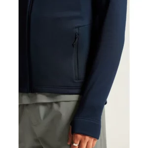 Chaqueta polar hombre CRAFT EXPLORE POWER FLEECE 1915240, Blaze, con modelo, detalle de bolsillo y puño