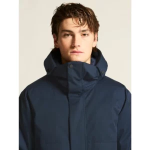 Parka hombre CRAFT URBAN PADDED PARKA 1916377, Blaze, con modelo, detalle de cuello y pecho