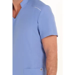 Casaca elástica chico azul Dyneke 8126407: detalle de la manga y bolsillo.