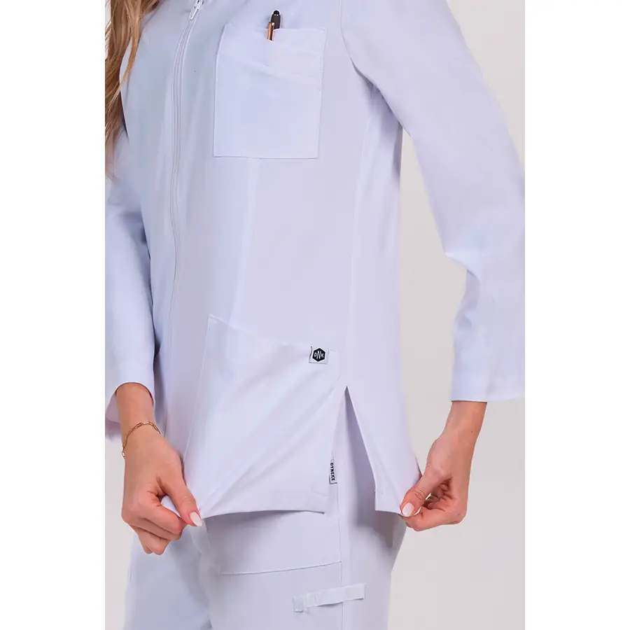 Chaqueta Dyneke 8216412 mujer blanca elástica 4 Chaqueta mujer poliéster elástico blanco m/l Dyneke 8216412: detalle del bolsillo lateral y abertura.