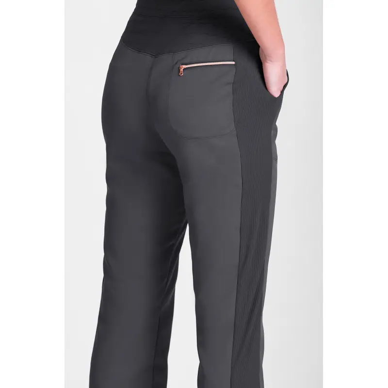 Pantalón sanitario de mujer Norvil 1717 2 Pantalón sanitario de mujer Norvil 1717 en gris oscuro, vista trasera, sobre modelo y encuadre parcial.