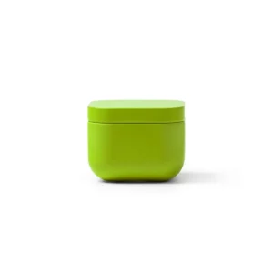 Vela aromática Stamina Trini 1528, verde oasis, vista frontal de la vela cerrada