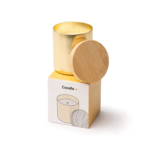 Vela aromática Stamina Maris 1597, oro, vista de la vela junto a la caja