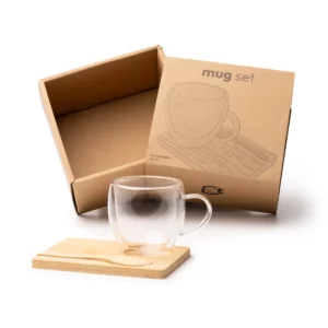 Set de taza y posavasos Stamina Blumon 1848, transparente, vista del set junto a su caja de diseño