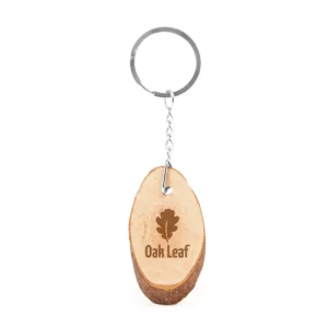Llavero de madera natural Stamina Budan 4054, diseño ovalado, ejemplo de marcaje sobre el diseño ovalado