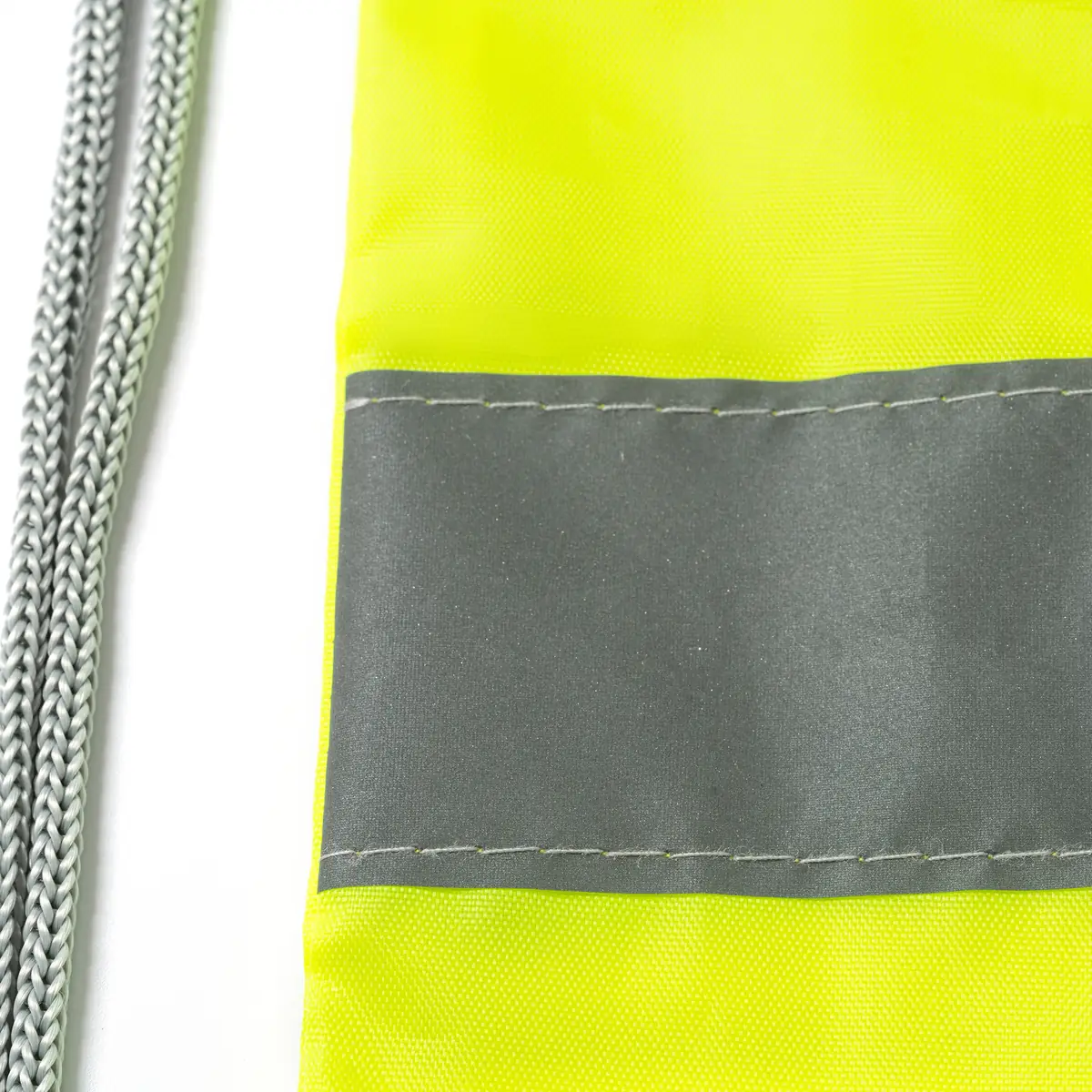 Pack 10 mochilas con banda Stamina Labur 7184 5 Mochila de cuerdas Stamina Labur 7184, amarillo flúor, detalle de la banda reflectante