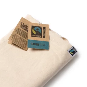 Una unidad del pack de 10 delantales de algodón Stamina Taber 9141, crudo, vista del delantal doblado con su etiqueta