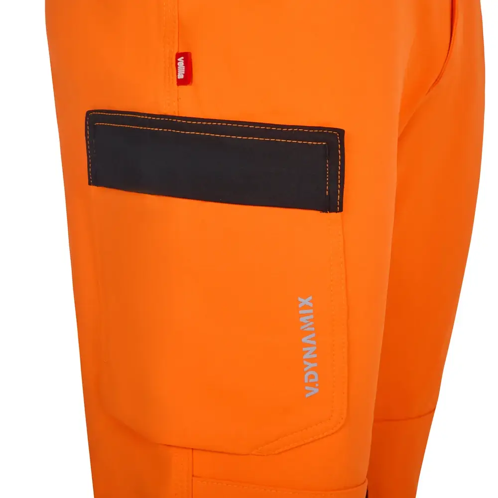 Pantalón técnico Velilla 303030X V.Dynamix Hi Vis 22 Pantalón técnico Velilla 303030X V.Dynamix Hi Vis Negro/Naranja flúor, detalle de bolsillo lateral con tapeta