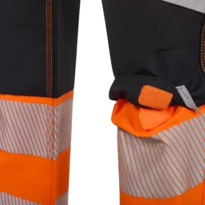 Pantalón técnico Velilla 303030X V.Dynamix Hi Vis Negro/Naranja flúor, detalle de compartimento para rodillera y cierre de velcro