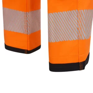 Pantalón técnico Velilla 303030X V.Dynamix Hi Vis Negro/Naranja flúor, detalle de bandas reflectantes y bajo
