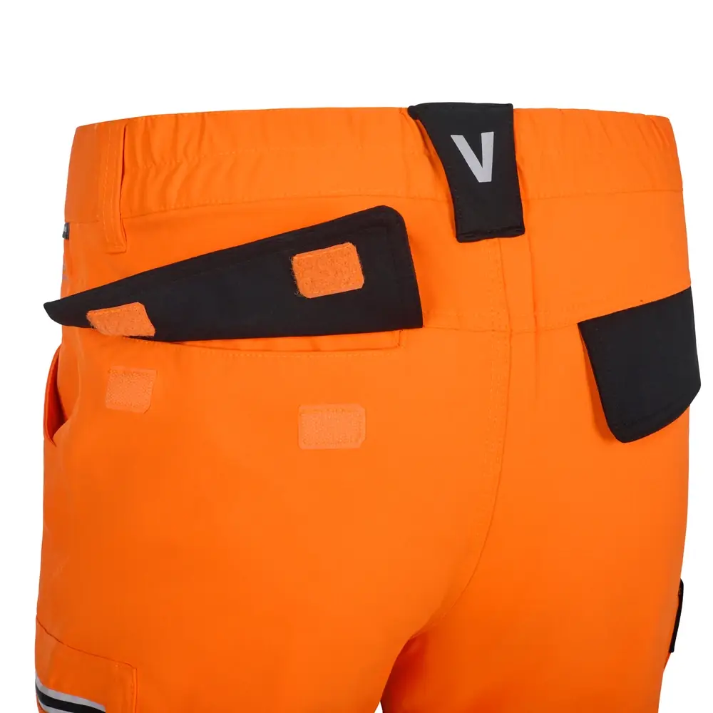 Pantalón técnico Velilla 303030X V.Dynamix Hi Vis 26 Pantalón técnico Velilla 303030X V.Dynamix Hi Vis Negro/Naranja flúor, detalle de bolsillo trasero con tapeta abierta