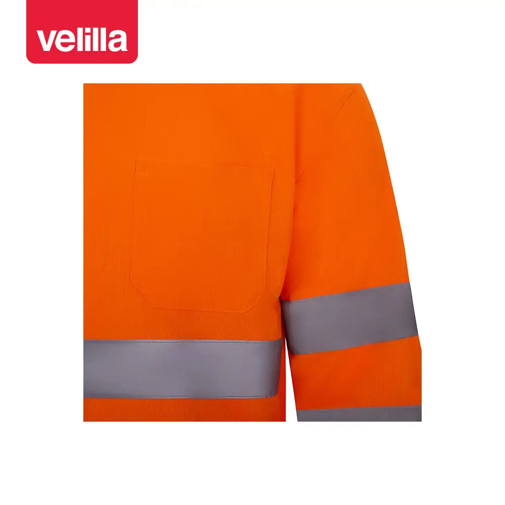Polo manga larga Velilla 305511 11 Polo manga larga Velilla 305511 naranja flúor, detalle de pecho y cinta reflectante